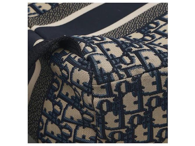 Christian Dior A travel backpack featuring Dior's iconic Oblique jacquard pattern. Made from waterproof technical canvas material, it offers a lighter weight than leather along with scratch-resistant durability. A - view 5