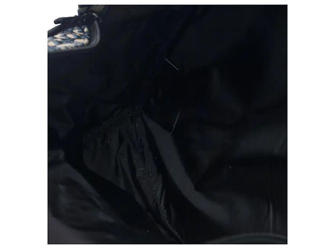 Christian Dior A travel backpack featuring Dior's iconic Oblique jacquard pattern. Made from waterproof technical canvas material, it offers a lighter weight than leather along with scratch-resistant durability. A - view 7