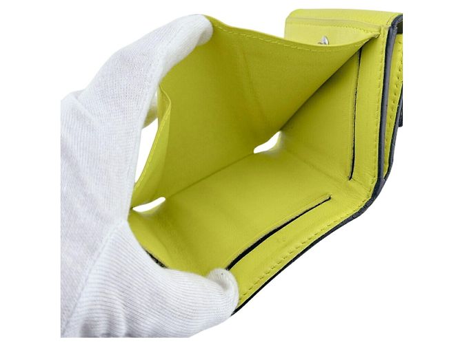 Cartera compacta Louis Vuitton Taigarama Discovery Amarillo - vista 7