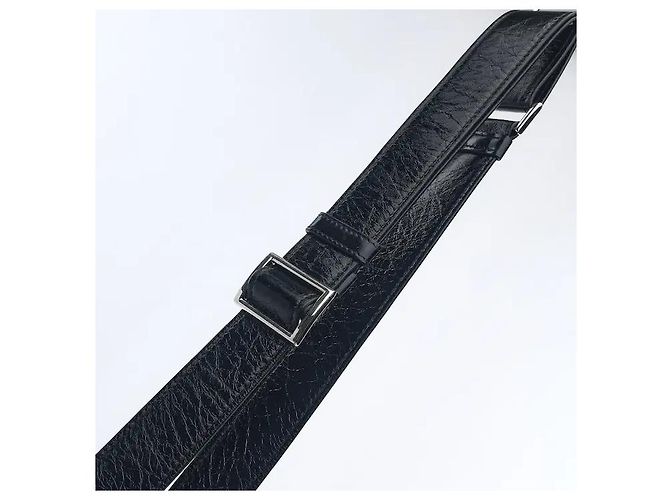 A leather shoulder bag showcasing smooth leather material and Prada's signature triangle logo. Its compact yet practical interior storage structure makes it easy to separately store belongings, and - view 6