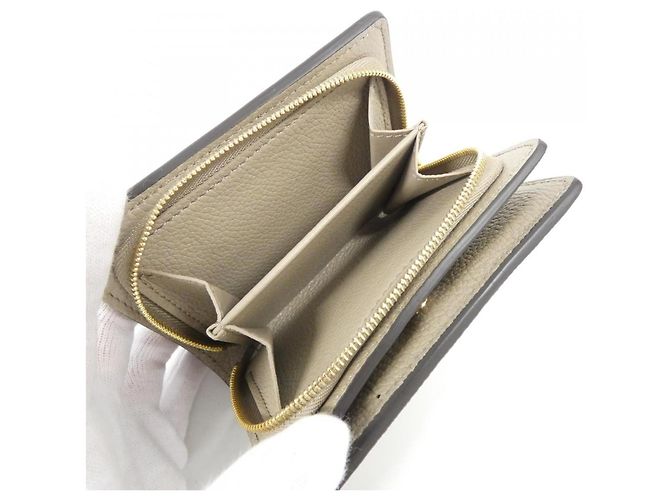 Louis Vuitton Bicolor Monogram Empreinte Portefeuille Claire Wallet Beige Grigio Crudo - vista 9