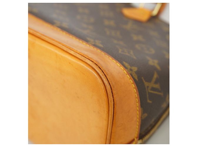 Bolso de mano Louis Vuitton Alma Monogram M51130 Castaño - vista 9