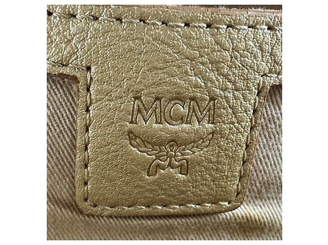 Sac à dos MCM en cuir noir et doré - vue 12