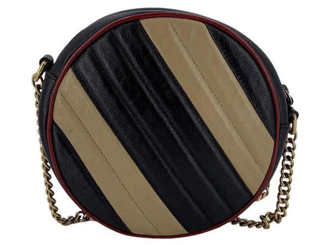 Gucci Borsa a tracolla rotonda GG Marmont in pelle matelassé a righe nero e beige - vista 3