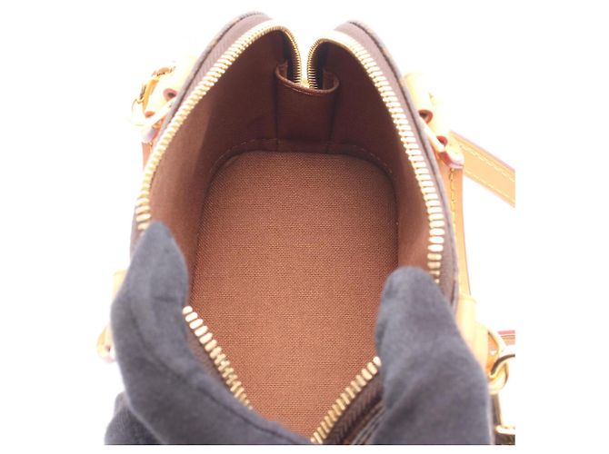 Bolso de mano Louis Vuitton Nano Alma Monogram Castaño - vista 3