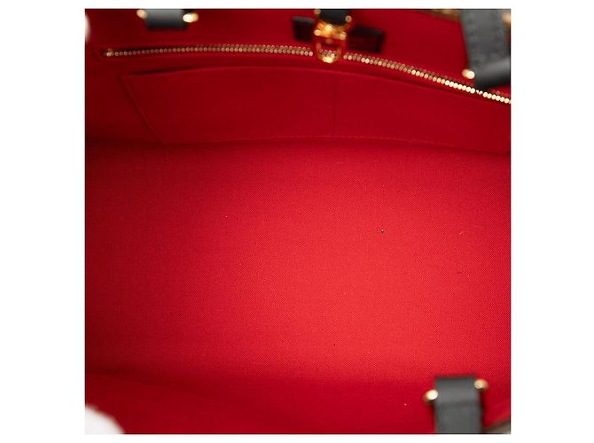 Bolso Louis Vuitton On The Go MM Monogram Giant Reverse Castaño - vista 4