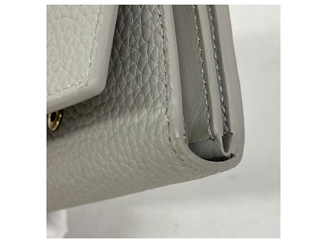 Louis Vuitton Portefeuille Capucines Tiny Wallet Castaño - vista 5