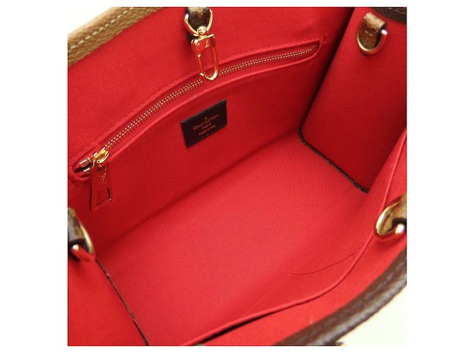 Bolso Louis Vuitton Monogram Giant Reverse OnTheGo PM Castaño Monograma - vista 6