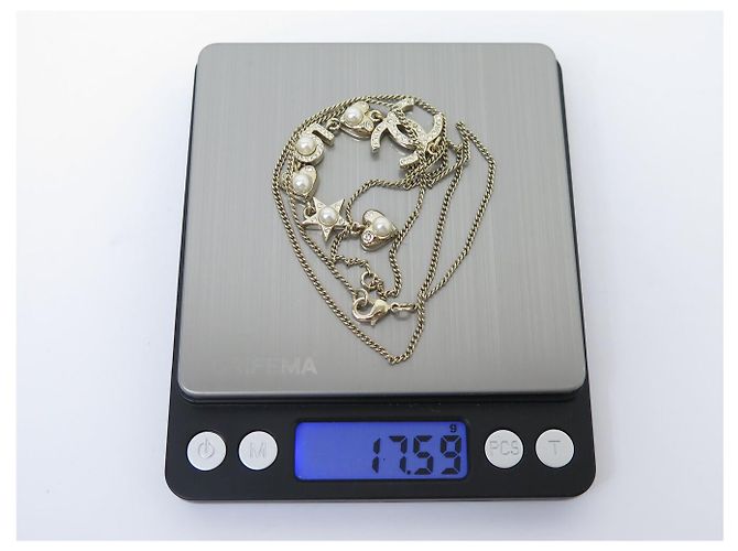 COLLANA CHANEL PENDENTE LOGO CC CUORE STELLA 2019 IN METALLO DORATO D'oro - vista 6