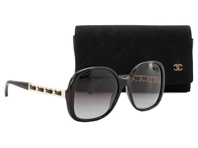 CHANEL - Óculos de sol Chanel em plástico e couro preto e dourado - vista 6
