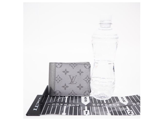 Louis Vuitton Taigarama Portefeuille Multiple Bi-fold Wallet Prata - vista 4