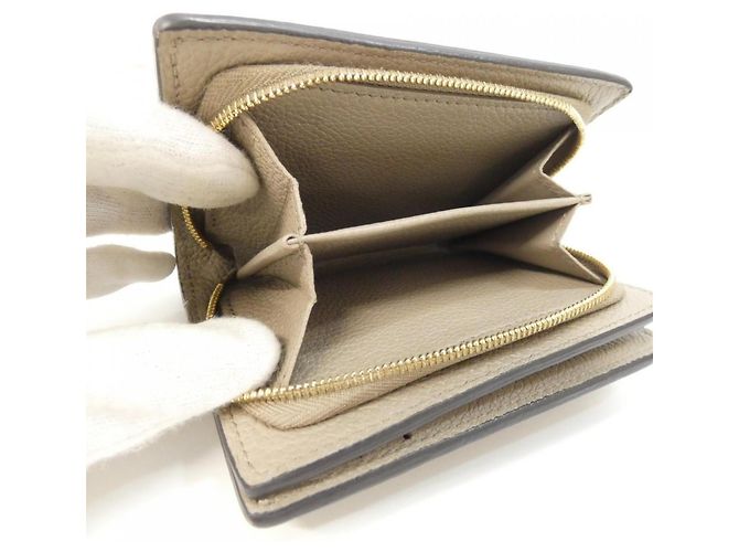 Louis Vuitton Bicolor Monogram Empreinte Portefeuille Claire Wallet Beige Grigio - vista 10