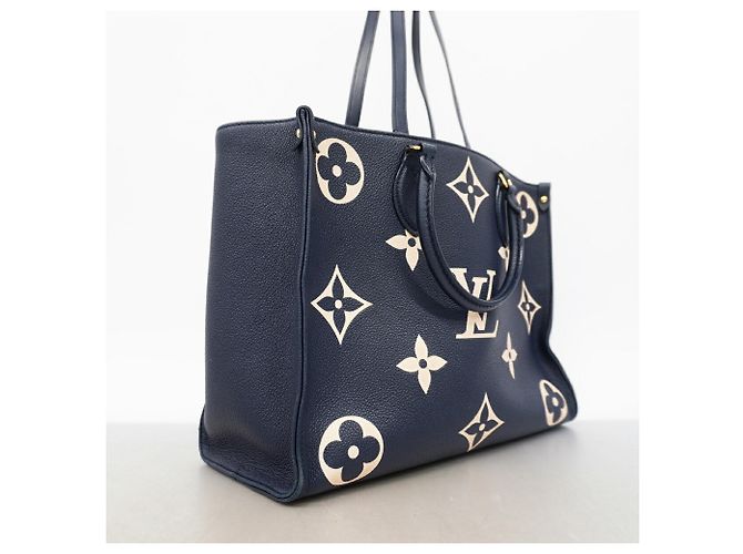 Borsa Tote Louis Vuitton Monogram Empreinte Bicolor OnTheGo MM Blu Crudo - vista 2