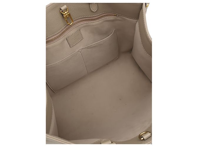 Louis Vuitton Beige Monogram Empreinte OnTheGo MM - vista 4