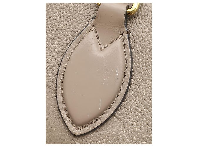 Louis Vuitton Beige Monogram Empreinte OnTheGo MM - vista 7