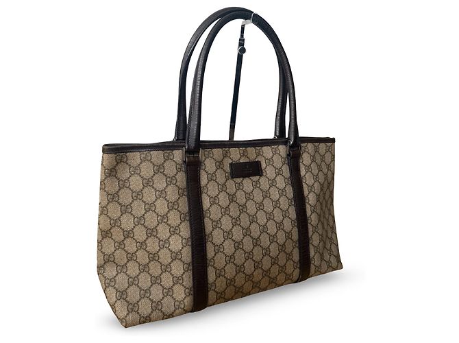 Una bellissima borsa Tote di Gucci con il classico monogramma GG e dettagli in pelle viola. - vista 5