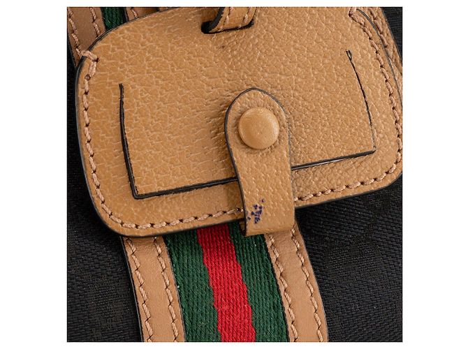 GUCCI - Gucci Bauletto Schultertasche aus schwarzem monogrammiertem Canvas und braunem Leder - Ansicht 6