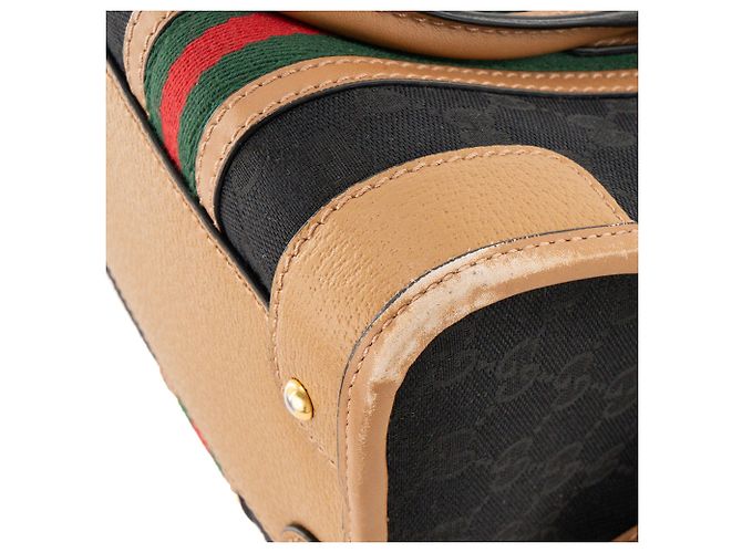 GUCCI - Gucci Bauletto Schultertasche aus schwarzem monogrammiertem Canvas und braunem Leder - Ansicht 9