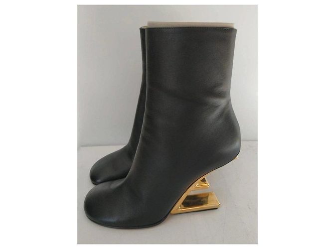 Fendi black leather ankle boots with gold heel. - view 16