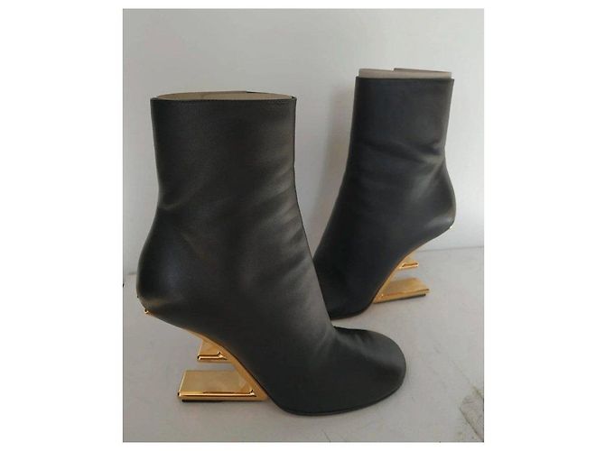 Fendi black leather ankle boots with gold heel. - view 2