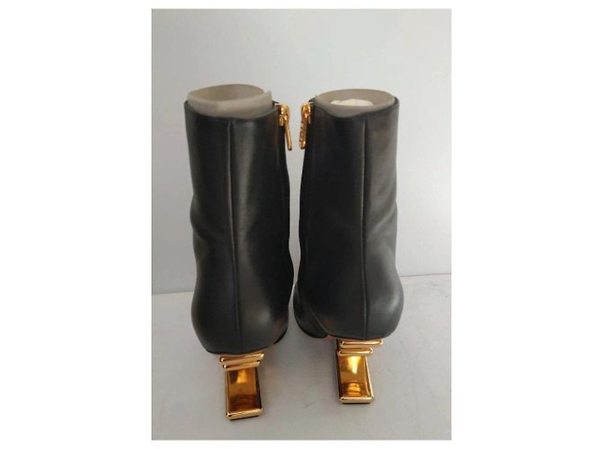Fendi black leather ankle boots with gold heel. - view 5