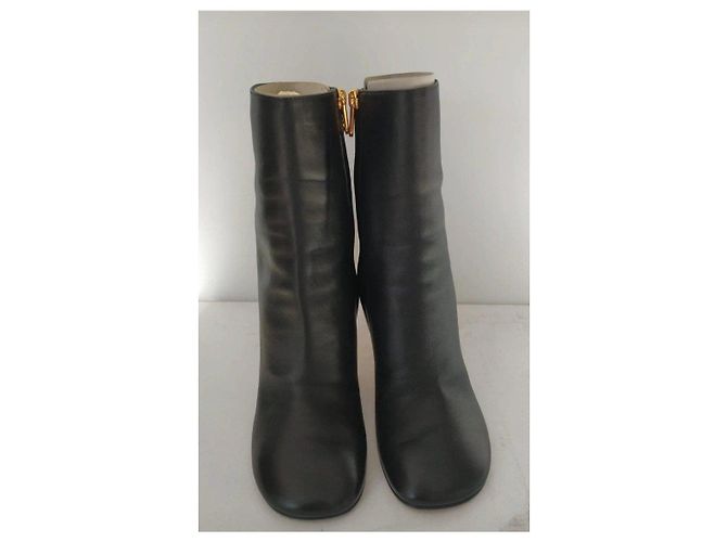 Fendi black leather ankle boots with gold heel. - view 6