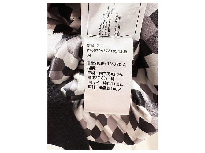 Chaqueta Chanel 21P de tweed negra y dorada cruzada - vista 5