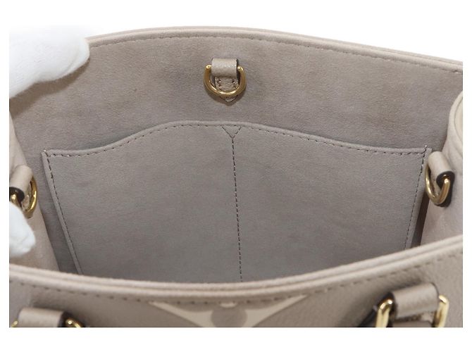 Borsa Tote Louis Vuitton Onthego PM Bicolor Monogram Empreinte - vista 8