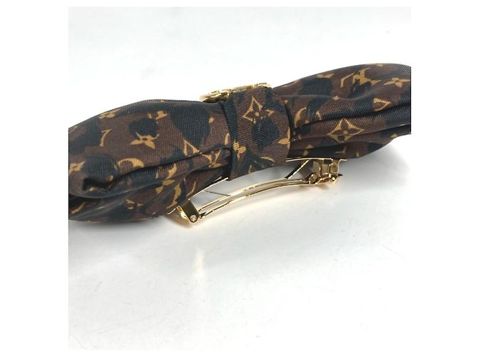 Fermi capelli Louis Vuitton con stampa leopardata - vista 4