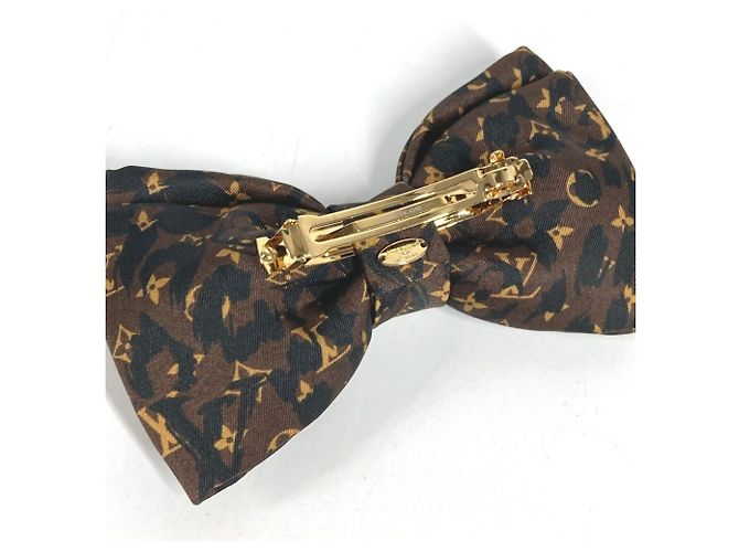 Fermi capelli Louis Vuitton con stampa leopardata - vista 6