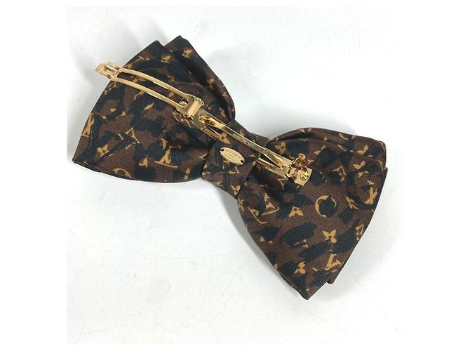 Fermi capelli Louis Vuitton con stampa leopardata - vista 8
