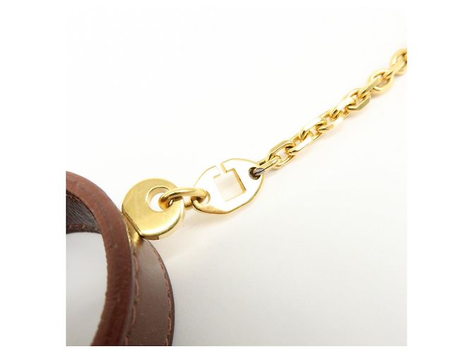 Hermès HERMES Portaguanti Nomad in pelle e metallo Charm Brown - vista 10