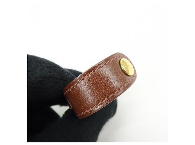 Hermès HERMES Portaguanti Nomad in pelle e metallo Charm Brown - vista 11