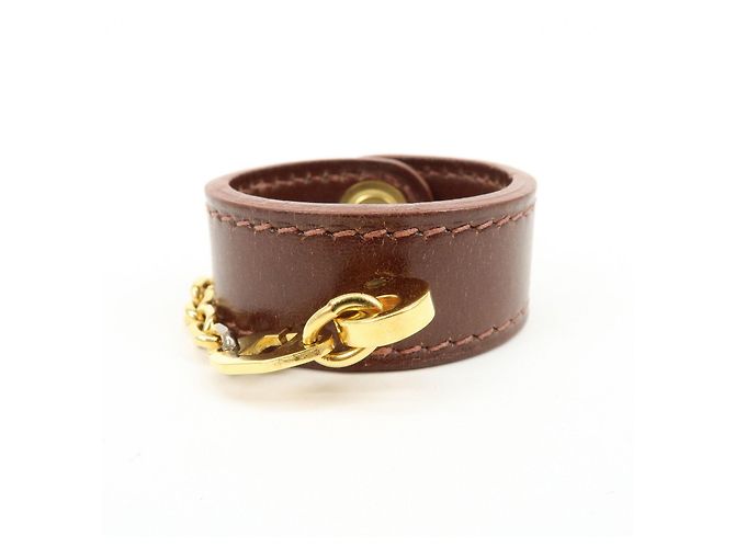 Hermès HERMES Portaguanti Nomad in pelle e metallo Charm Brown - vista 2