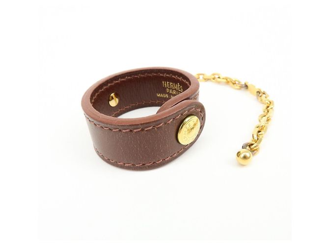 Hermès HERMES Portaguanti Nomad in pelle e metallo Charm Brown - vista 4
