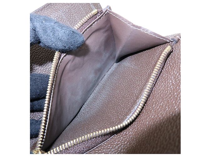 Louis Vuitton Empreinte Portefeuille Curieuse Compact Wallet M60543 - vista 20