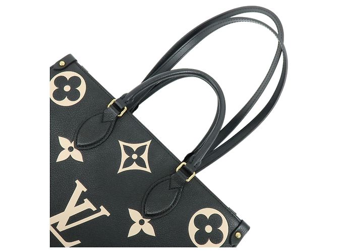 Louis Vuitton Bicolor Monogram Empreinte On The Go MM Noir Beige M45495 - vista 4