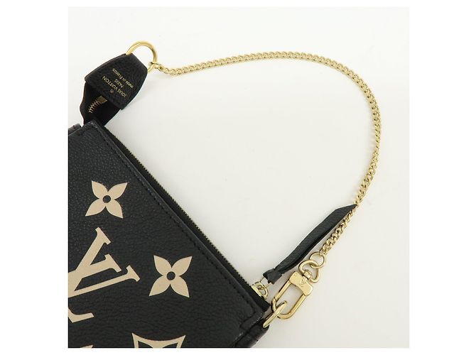 Louis Vuitton Monogram Bicolor Empreinte Mini Pochette Accessory M80732 - vista 6