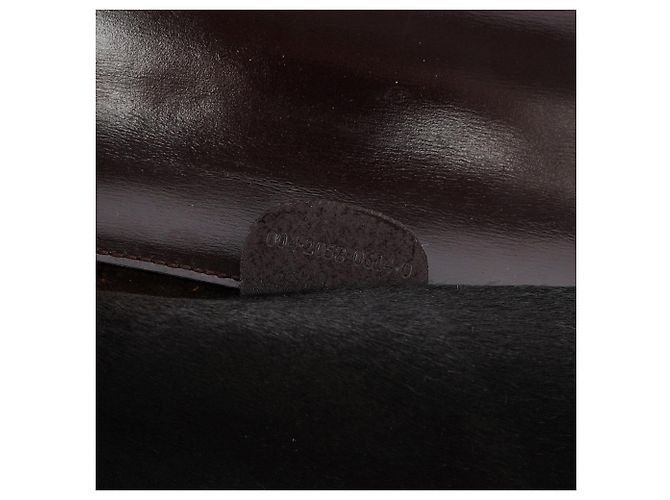 Gucci Clutch in pelliccia nera con placca dorata - vista 9