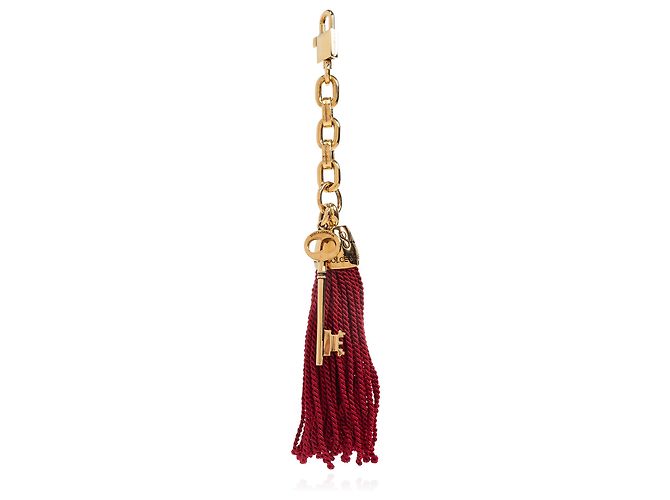Charm per borsa Dolce & Gabbana oro con chiave e nappa rossa - vista 2