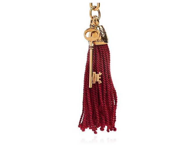 Charm per borsa Dolce & Gabbana oro con chiave e nappa rossa - vista 4