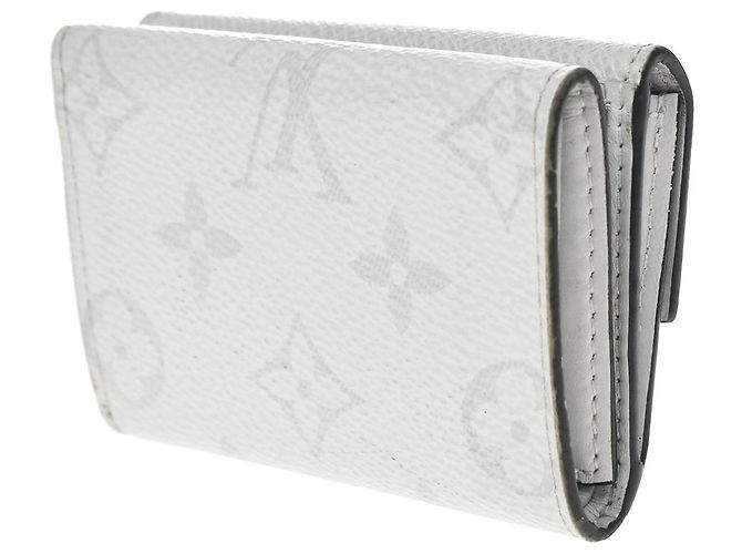 Louis Vuitton Discovery Monogram Taigarama Compact - vista 4
