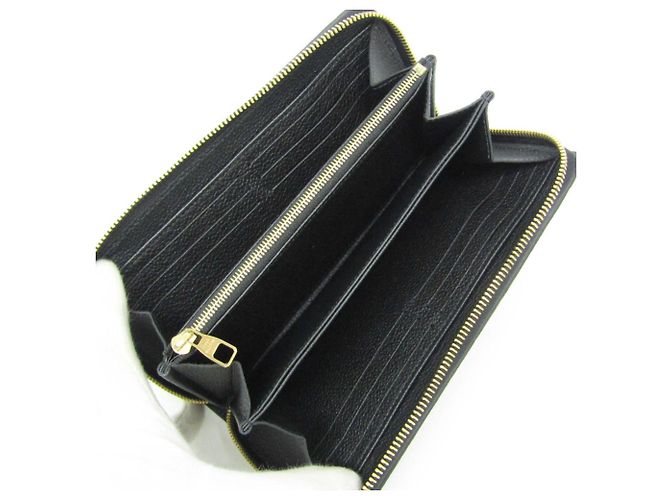 Portefeuille Zippy Monogram Empreinte Louis Vuitton - vue 4