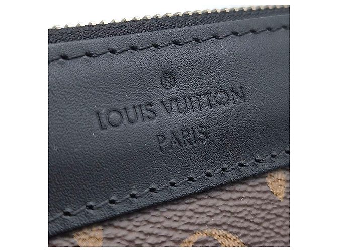 Louis Vuitton Monogram Discovery Pochette Clutch GM - vista 6