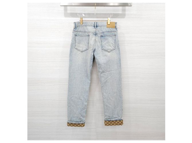 Gucci Pantaloni in denim dritti con risvolto e logo GG - vista 10
