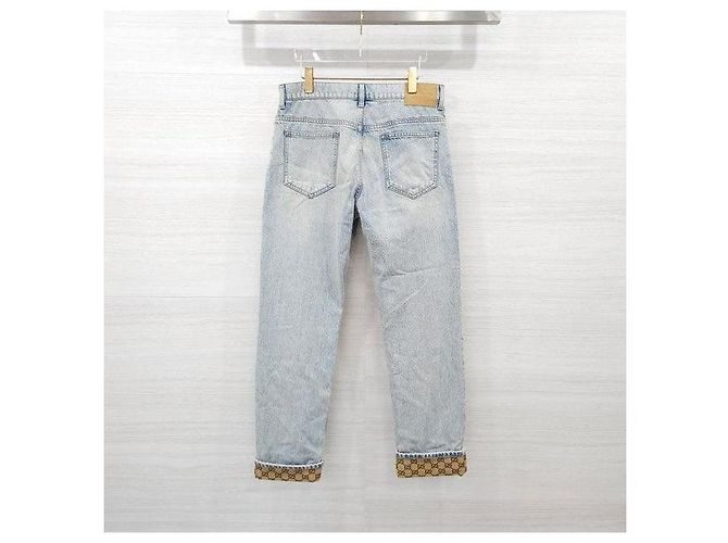 Gucci Pantaloni in denim dritti con risvolto e logo GG - vista 2