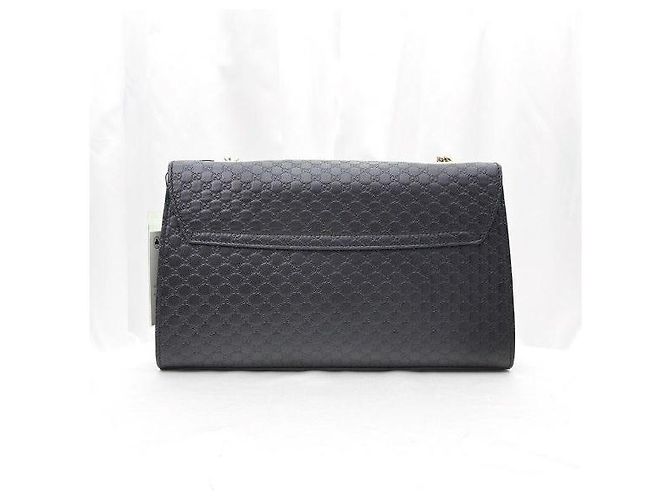 Borsa a tracolla Emily Micro Guccissima con morsetto e nappa Nera - vista 4
