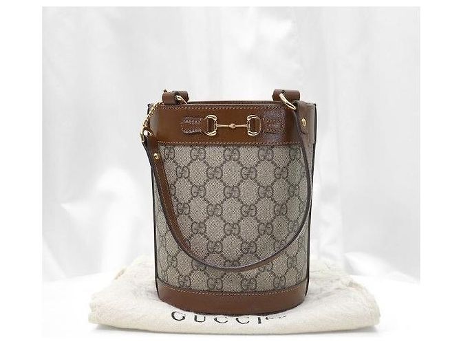 Gucci Borsa a secchiello a tracolla in pelle marrone con morsetto - vista 2