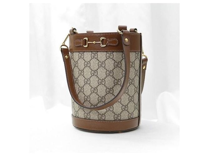 Gucci Borsa a secchiello a tracolla in pelle marrone con morsetto - vista 3