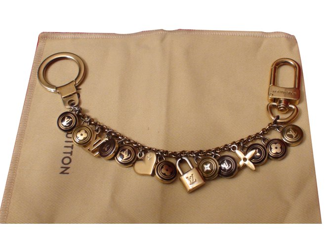 Louis Vuitton Encantos de saco Dourado Metal  ref.12057